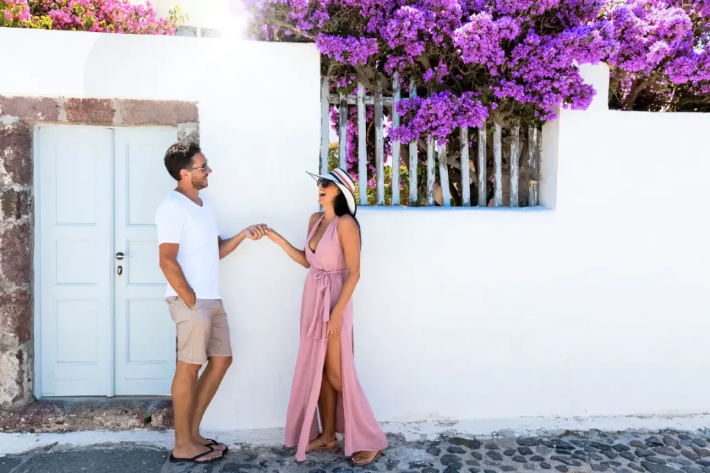 A couple on a cobblestone street in Greece.
