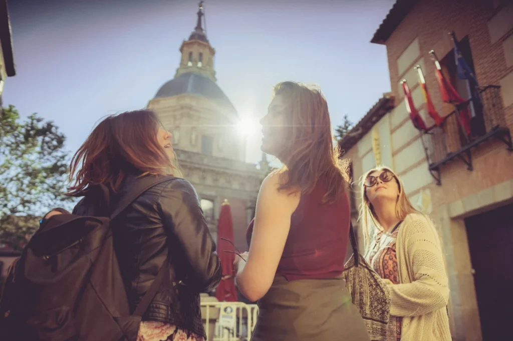 Three female tourists exploring Madrid