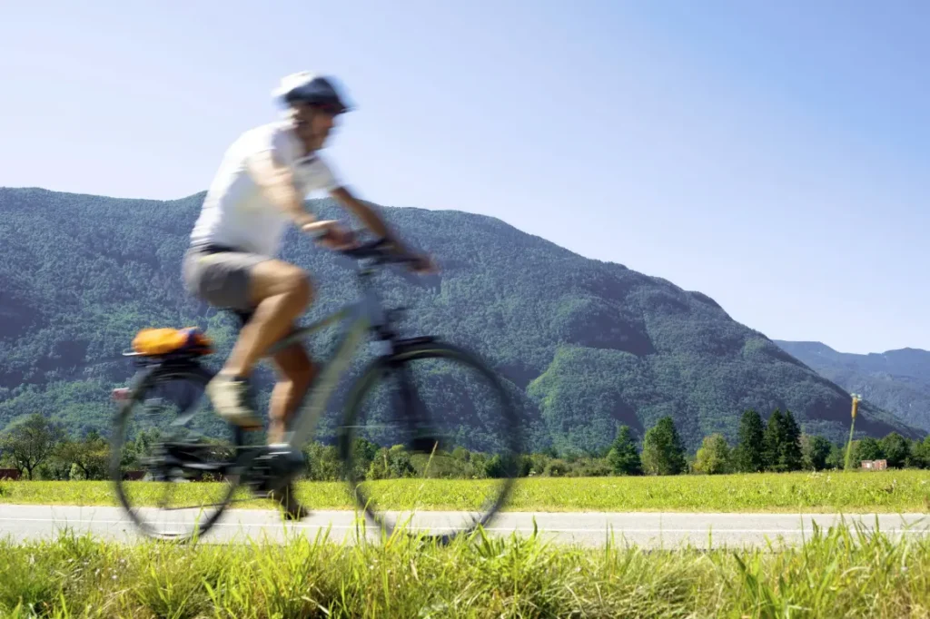 Man biking through the Slovenian countryside Man biking through the Slovenian countryside