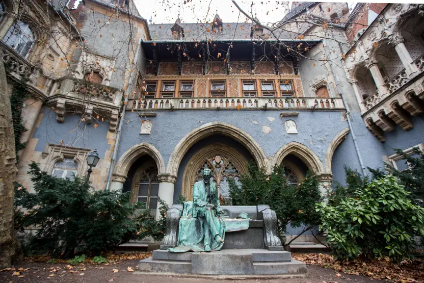 Statue in a courtyard at Vajdahunyad Castle