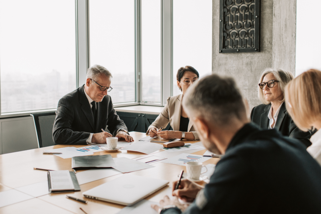 Several colleagues in a formal office meeting