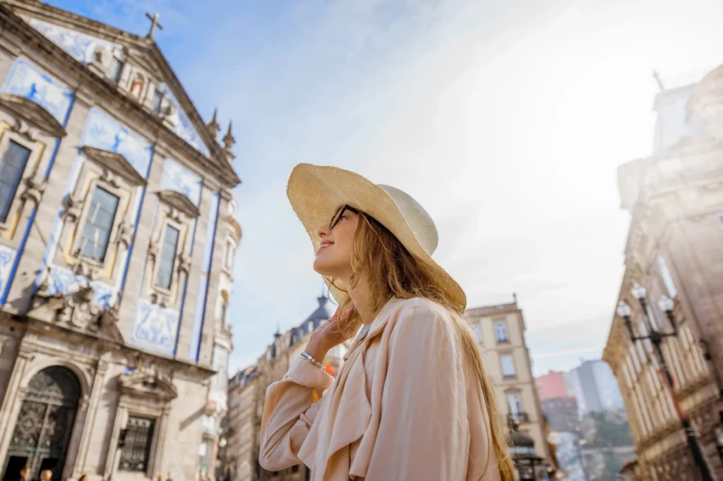 Female tourist wearing a hat in Porto