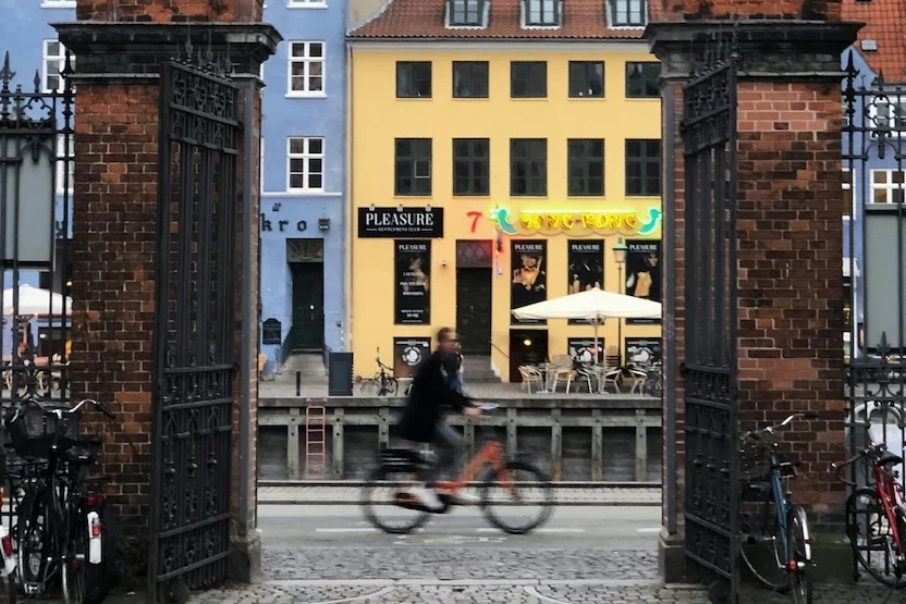 A person riding a bicycle in Copenhagen.
