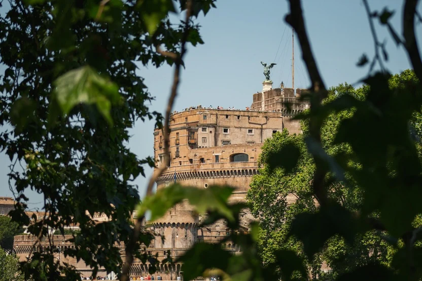 The Castel Sant Angelo peeking out from behind the trees in Rome.