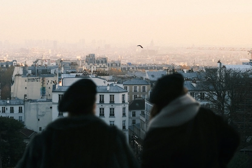 Travelers looking out towards Paris.