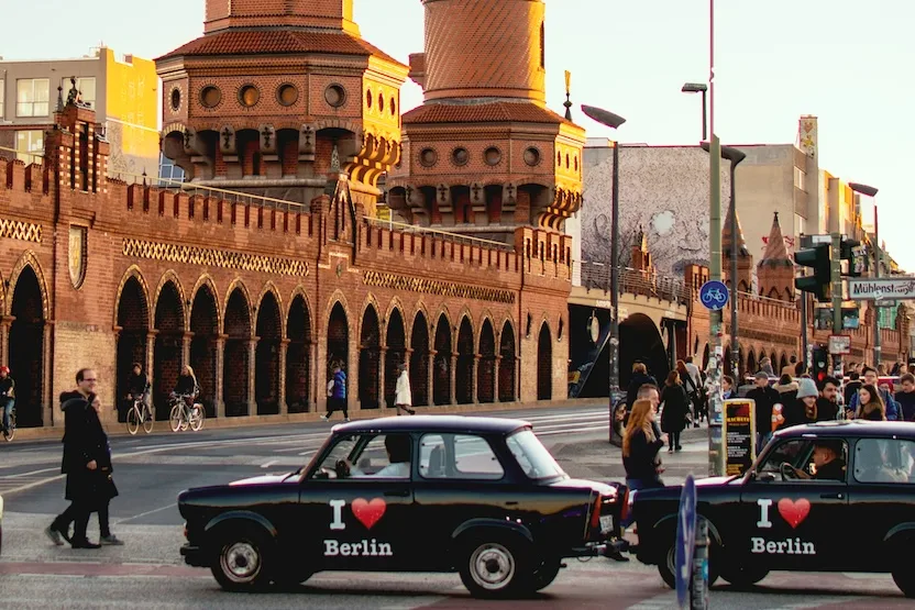 Black cars that say "I love Berlin" on the sides.
