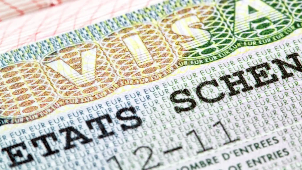 A Schengen visa in a passport, up close.