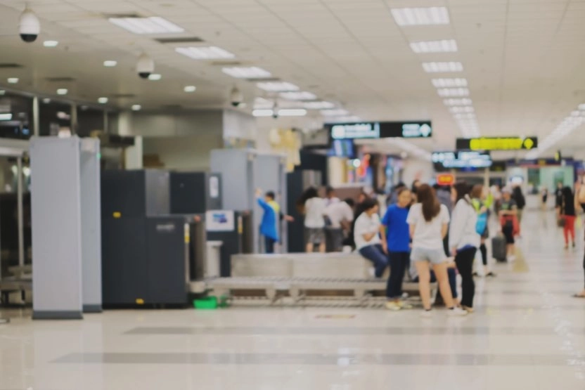 The security line at an airport, blurred for privacy.
