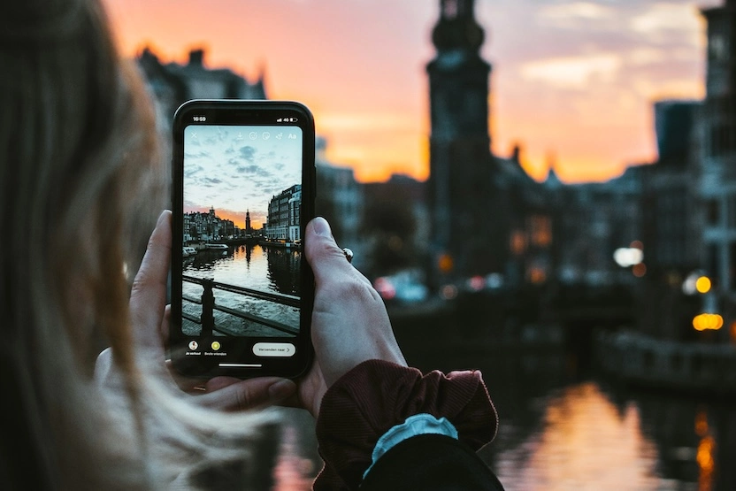 Tourist taking a photo in Amsterdam