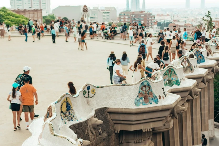 Tourists explore popular buildings in Barcelona, Spain.