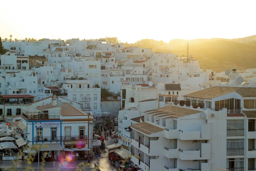 The white buildings of Albufeira, Portugal at sunset.