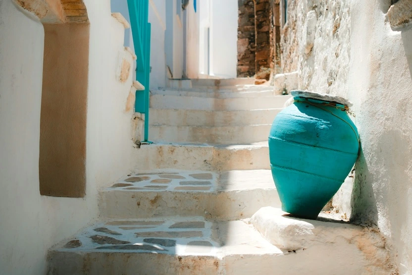 An aqua pot on a staircase in Naxos, Greece.