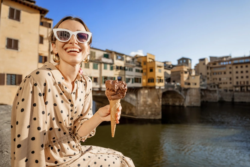 A woman eating gelato in Italy
