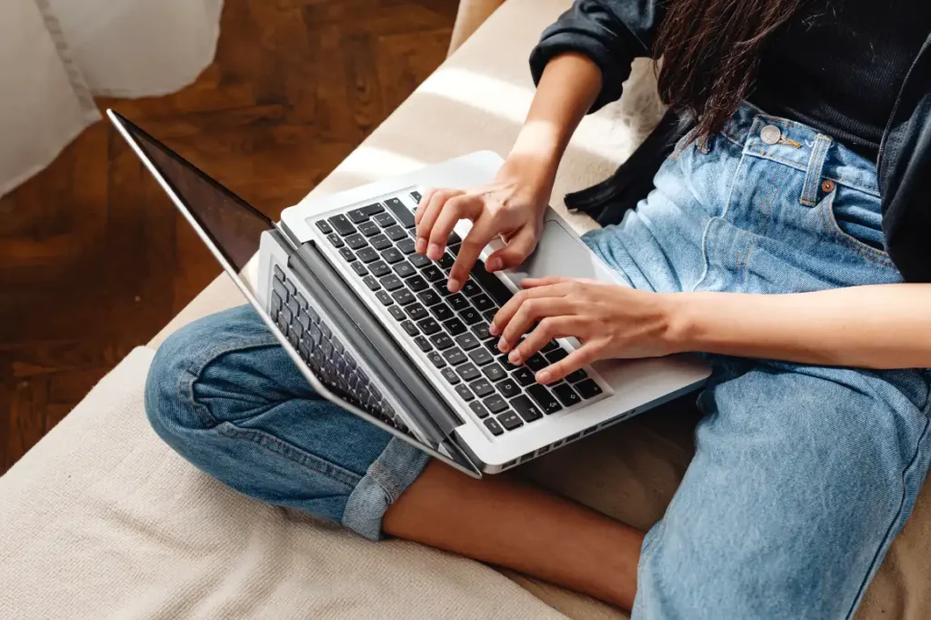Woman typing on her latop