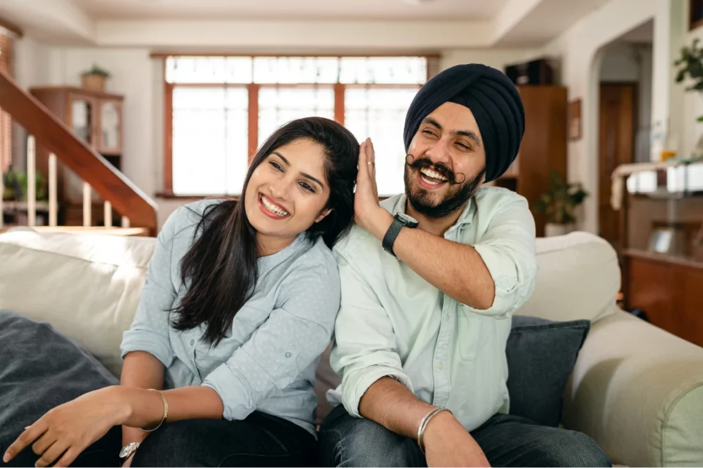 Happy couple in living room