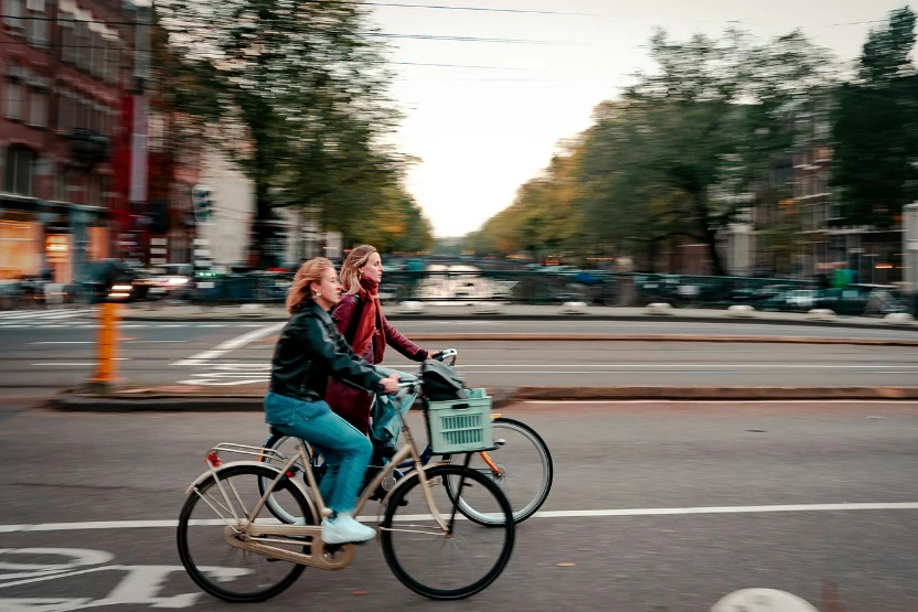 Friends riding bikes in Amsterdam