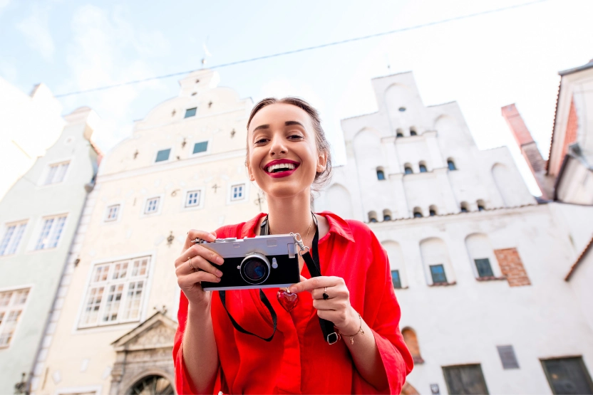 Female tourist taking photos in Riga, Latvia