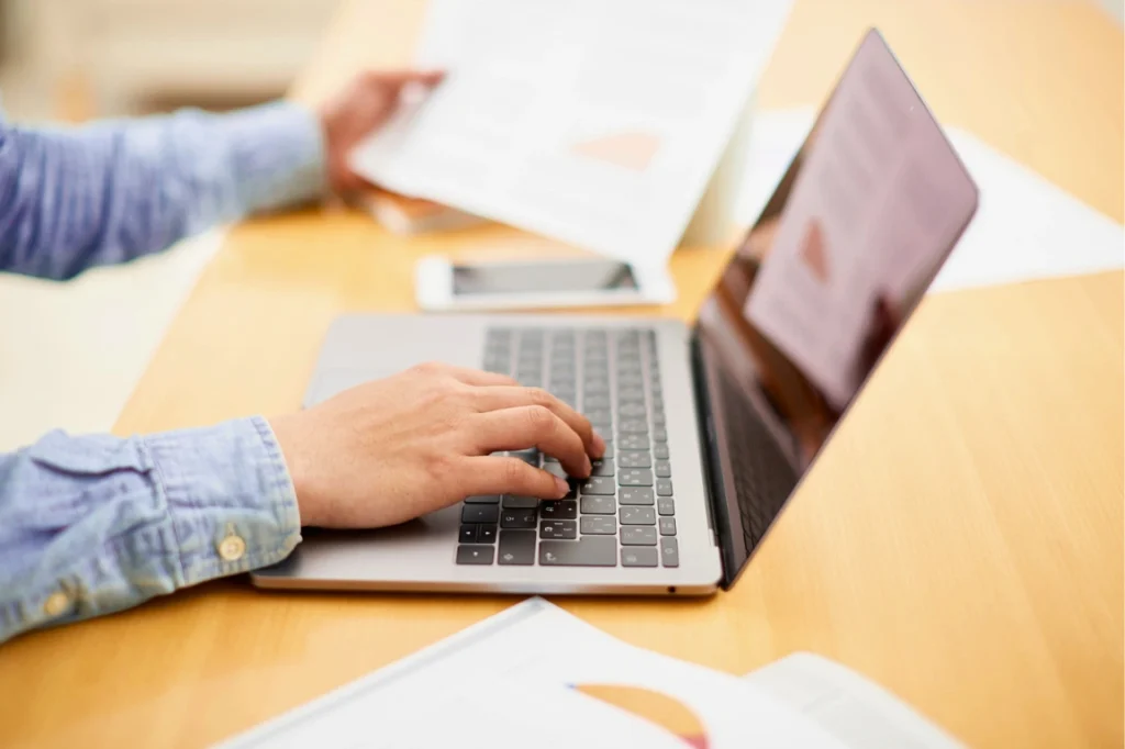 Man typing on laptop