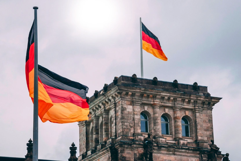 German flags over a gray sky