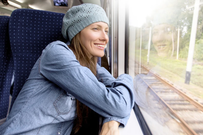 Woman on train, looking out the window