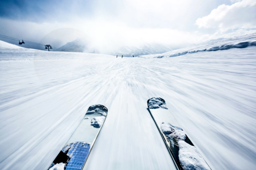The snowy ground from the viewpoint of skis