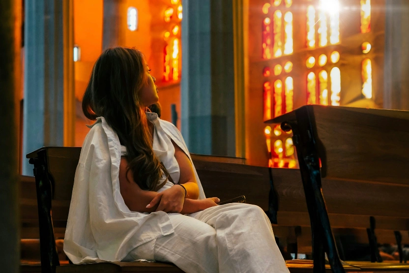 Woman tourist sitting in a cathedral.