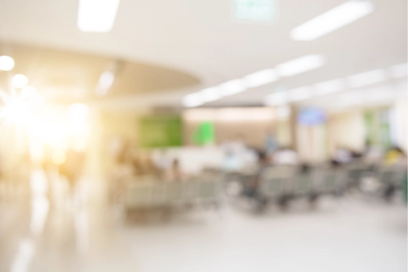 Blurry, editorial image of a hospital waiting area