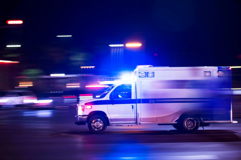 Ambulance driving quickly at night