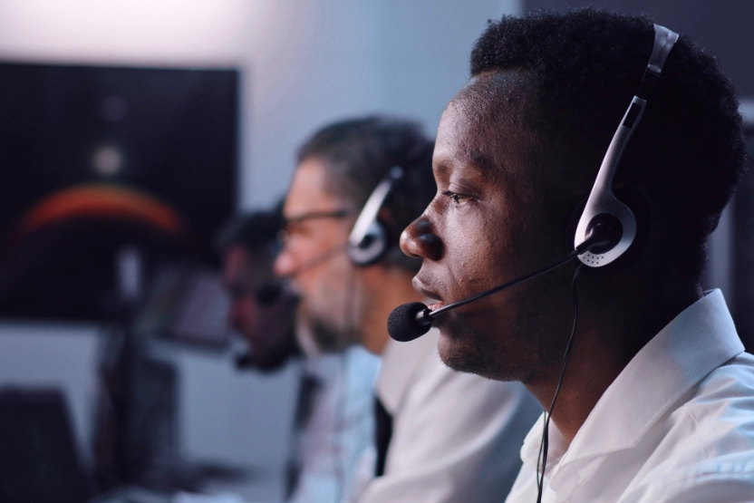 Emergency dispatchers with headsets on