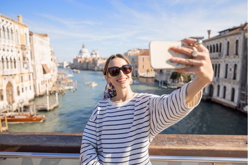 Woman taking a selfie in Italy