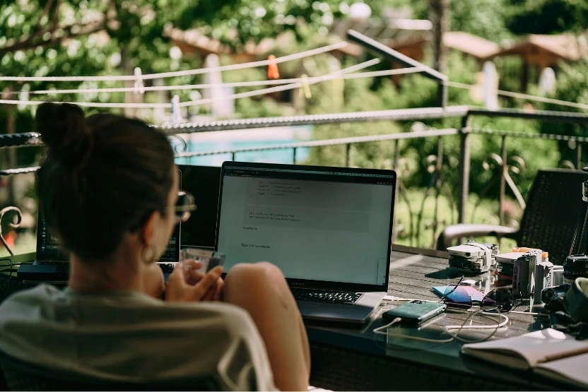 Female digital nomad working outside