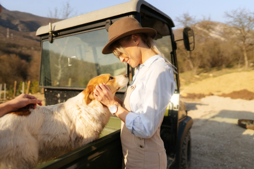 Woman and a dog on a farm